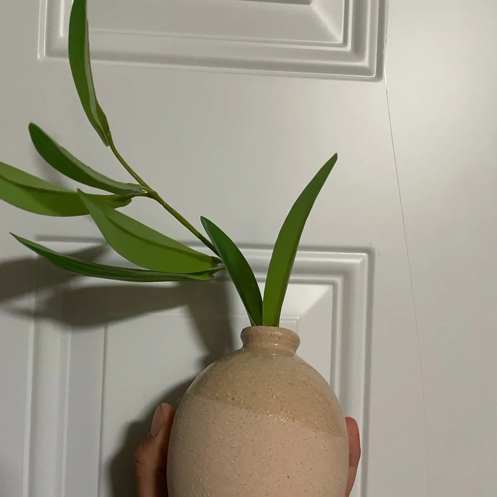 Ceramic vase with green plant cuttings tabletop arrangement from Threshold
